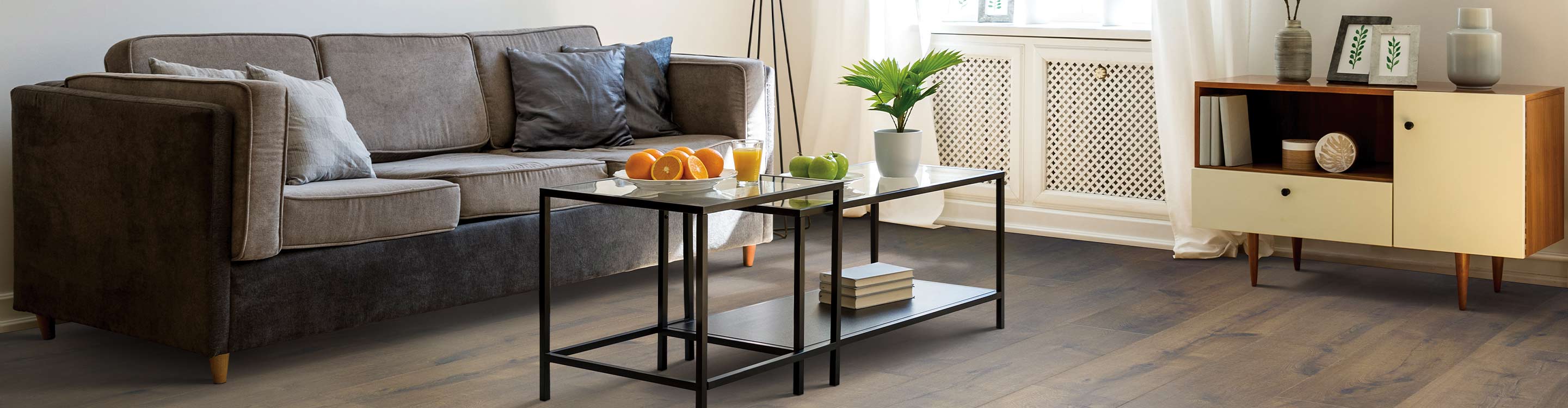 laminate flooring in living room with couch